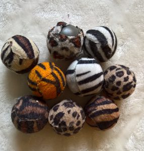 Hard plastic balls with cloth cover for your cat by healthycatdetective.com